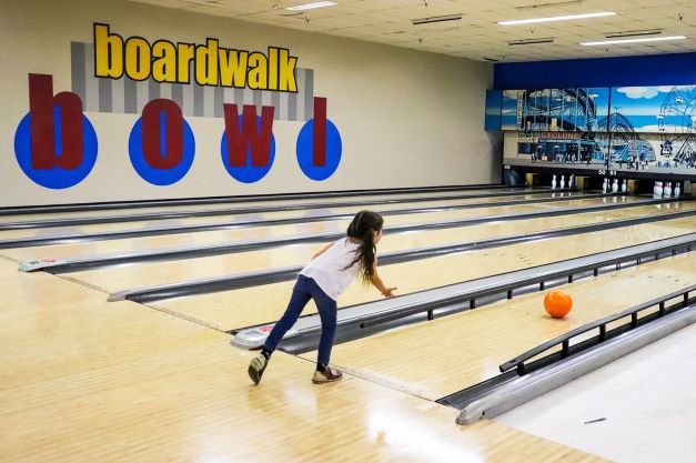 Slide into summer island style at Aloma Bowling Centers